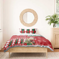 Red Christmas bedding set on bed, teddy bear center, green/red argyle pillows, snowflakes