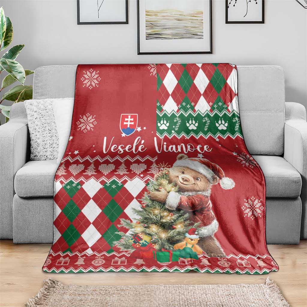 Red Christmas blanket featuring teddy bear holding a tree with green white diamond pattern