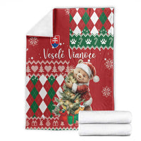 Red Christmas blanket set with bear artwork and green white diamond pattern, folded view