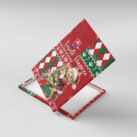 Angled red holiday canvas wall art with brown bear holding a gift, argyle knit design