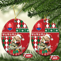 Two red ceramic circular Christmas ornaments with bear, argyle plaid and Slovak shield, gold hanging loops