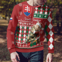 Red Christmas sweater with bear carrying a tree, green/white argyle diamonds, ribbed cuffs.