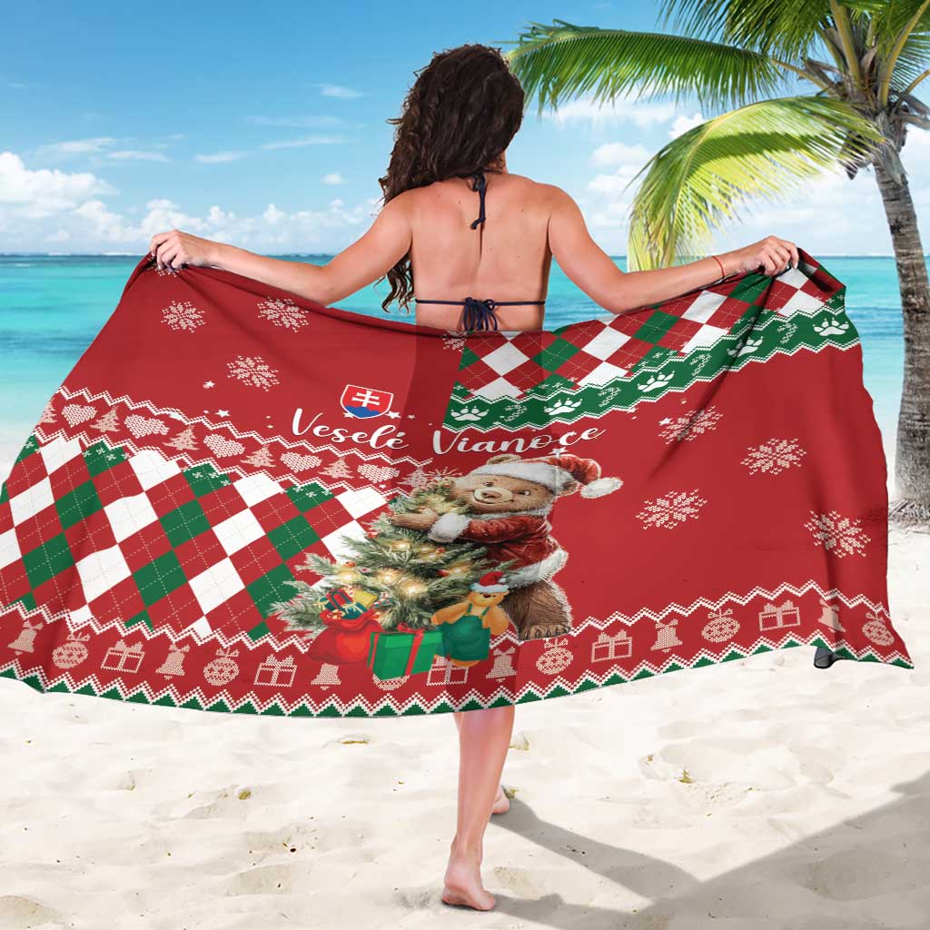 Christmas sarong with red base, green check/argyle stripe, teddy bear and snowflakes