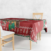 Red tablecloth with geometric argyle, reindeer and snowflake print