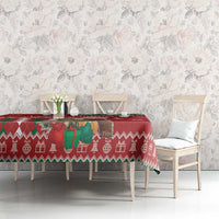 Red Christmas tablecloth with reindeer, snowflakes, and green argyle accents