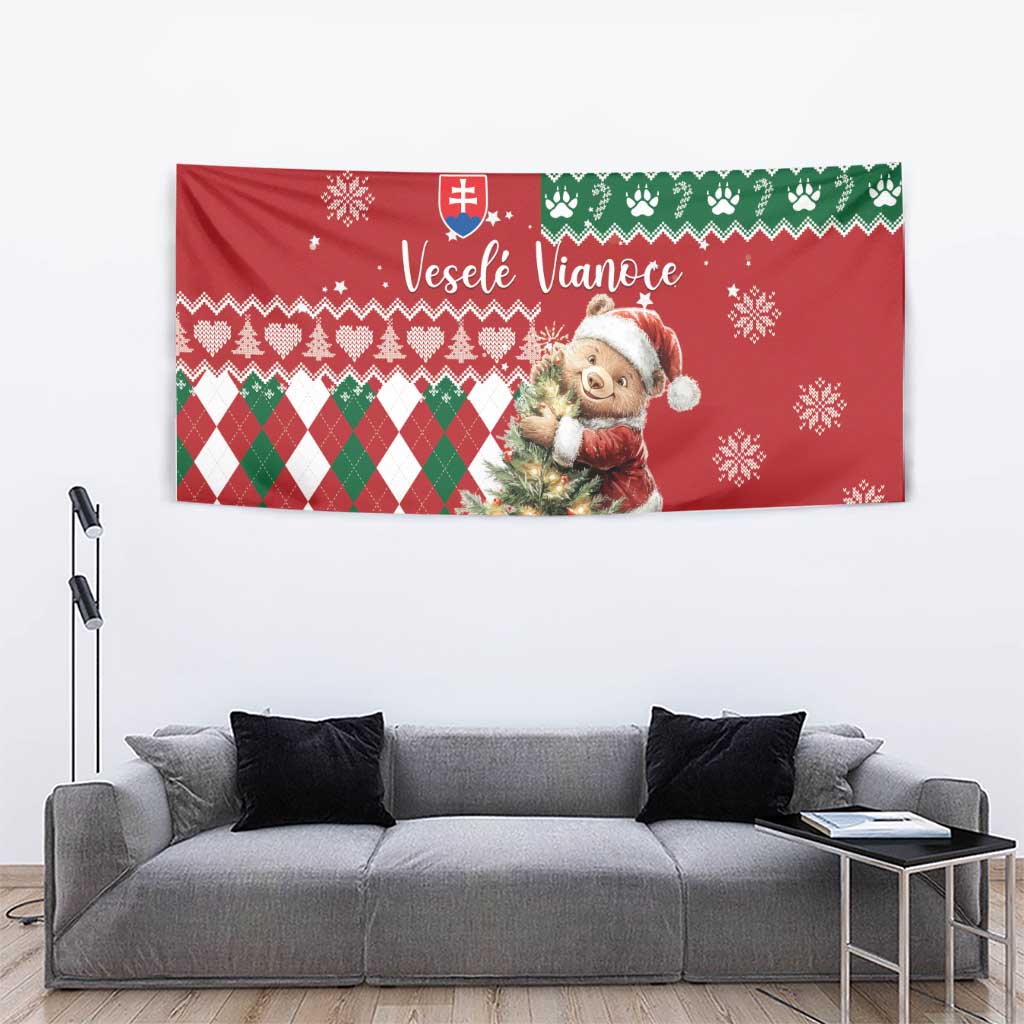 Red holiday tapestry showing bear holding gifts, snowflakes and green-and-white argyle pattern