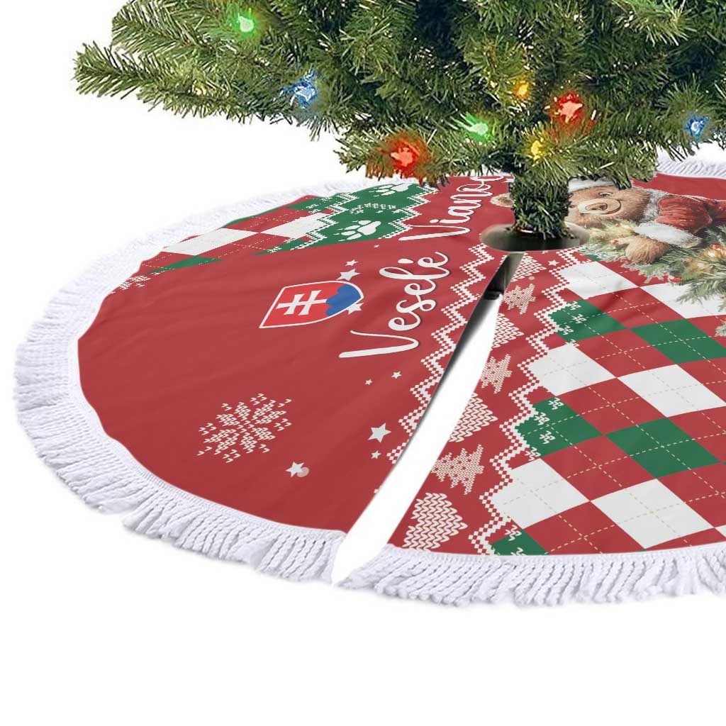 Red round Christmas tree skirt with white fringe, bear and argyle pattern, flat lay