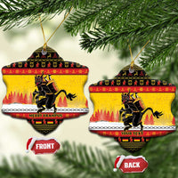 Yellow star-shaped ceramic Christmas ornament with Krampus artwork and gold hanging string.