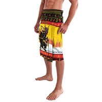 Yellow lavalava sarong with Krampus print and 'YOUR TEXT' panel, side view