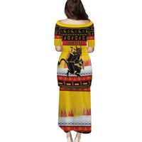 Yellow long dress with short sleeves, back view, custom text and Krampus print