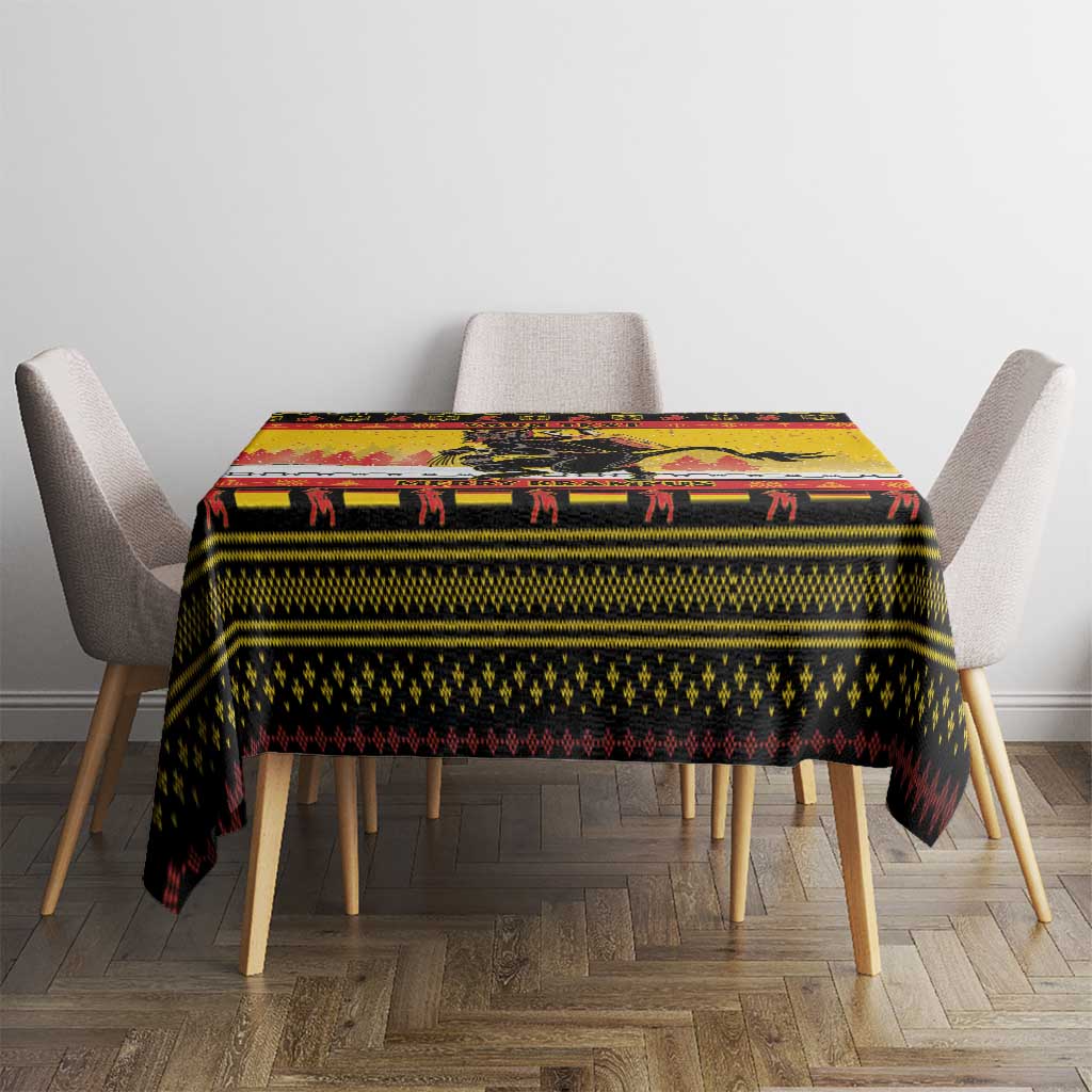 Yellow Christmas tablecloth on dining table with Krampus, chains, and “MERRY KRAMPUS”
