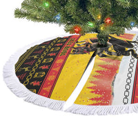 Yellow round Christmas tree skirt with fringed edge, Krampus scene with chain border.