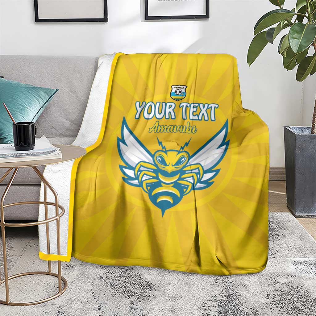 Yellow football blanket with blue crest and 'YOUR TEXT' 'Amawubi' text, indoor display
