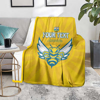 Yellow football blanket with blue crest and 'YOUR TEXT' 'Amawubi' text, indoor display