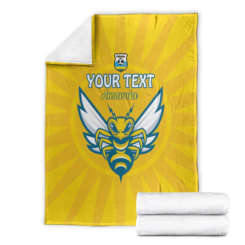 Yellow football blanket with blue crest, 'YOUR TEXT' 'Amawubi' and folded white fabric rolls
