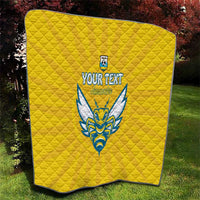 Yellow quilted football blanket with Rwanda emblem and blue crest, bordered edge