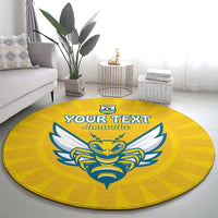 Yellow round rug with blue eagle crest and 'YOUR TEXT' logo