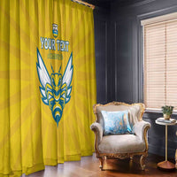 Yellow window curtain with blue crest and custom text, draped beside a window
