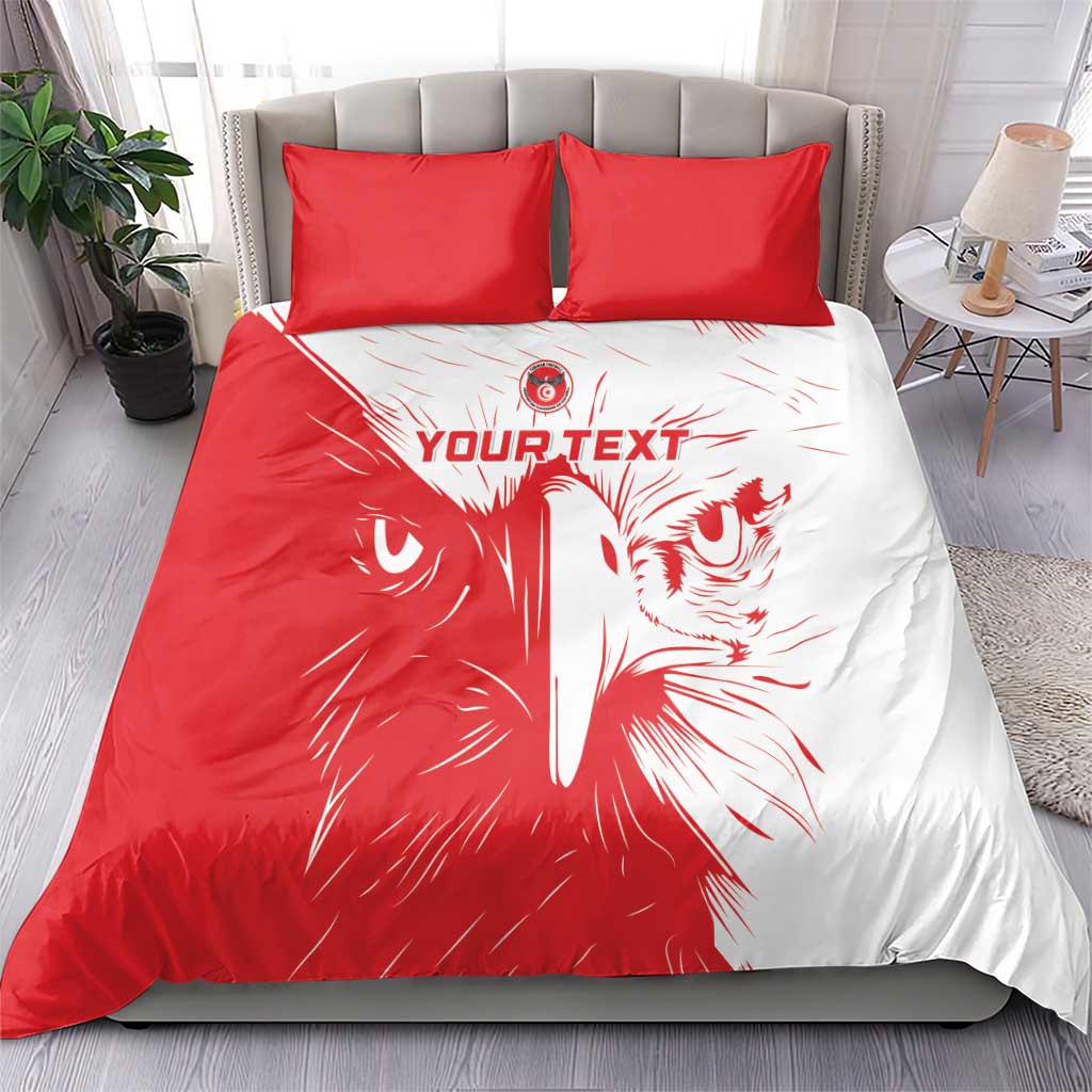 Red and white duvet with lion face artwork and two red pillowcases