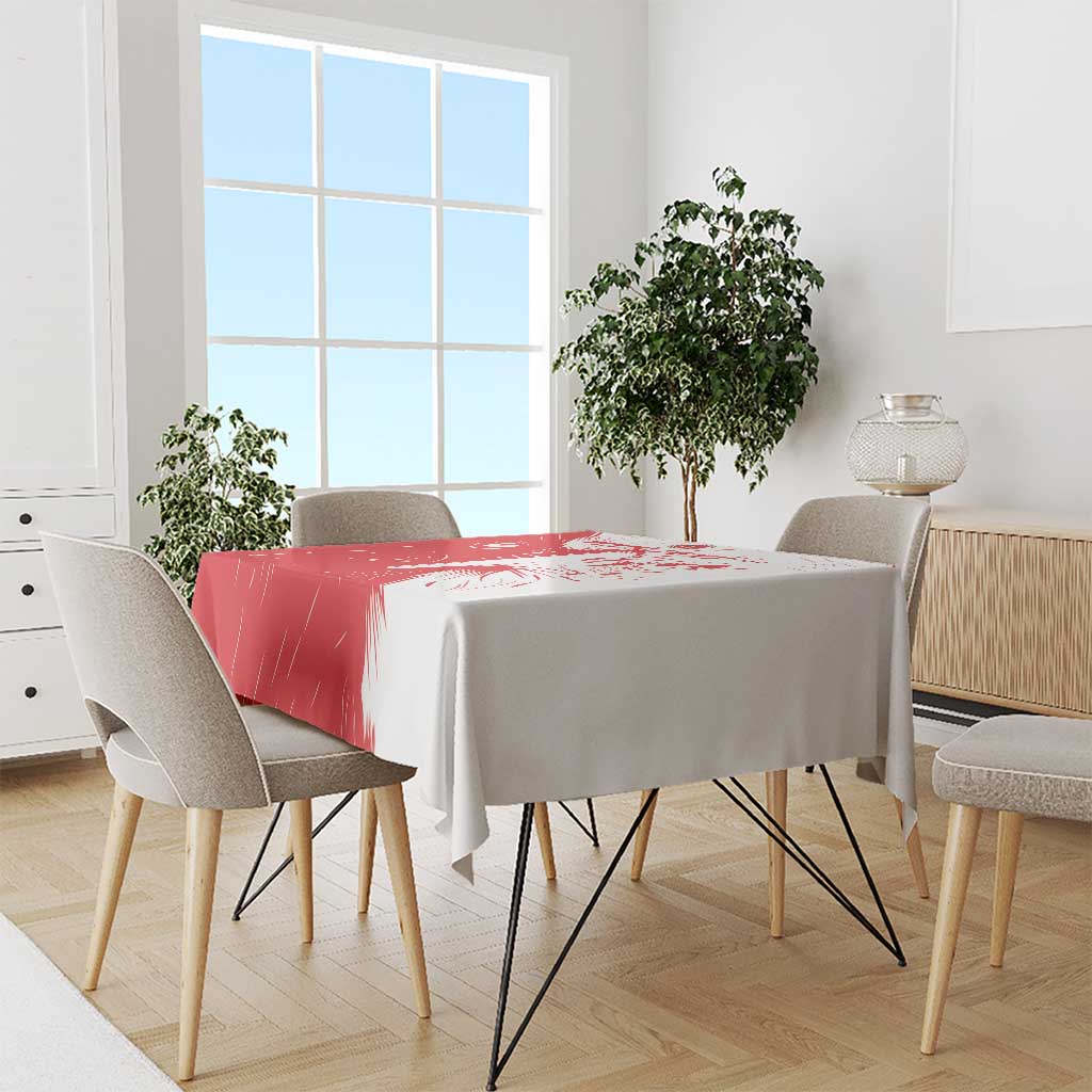 Red and white custom football tablecloth draped over square dining table