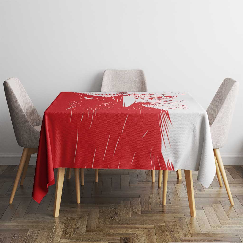 Red and white custom football tablecloth on small dining table with chairs