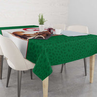 Green football tablecloth with repeating pattern and a centered fox and flag graphic