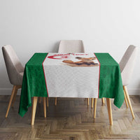 Green football tablecloth on a dining table, featuring patterned sides and a central graphic