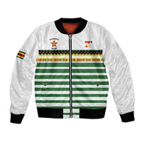 White bomber jacket with full zip, green striped panel, black ribbed cuffs, sleeve flag patch
