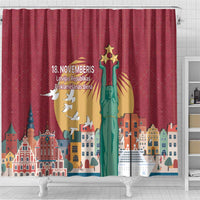 Red shower curtain with Latvian text 18. NOVEMBERIS and monument artwork