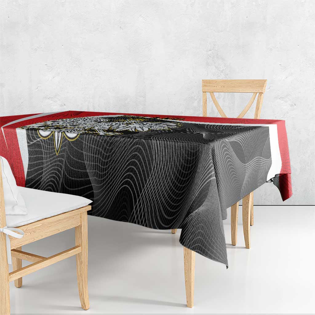 Red-edged black tablecloth with dark swirl pattern draped on table