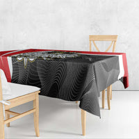 Red-edged black tablecloth with dark swirl pattern draped on table