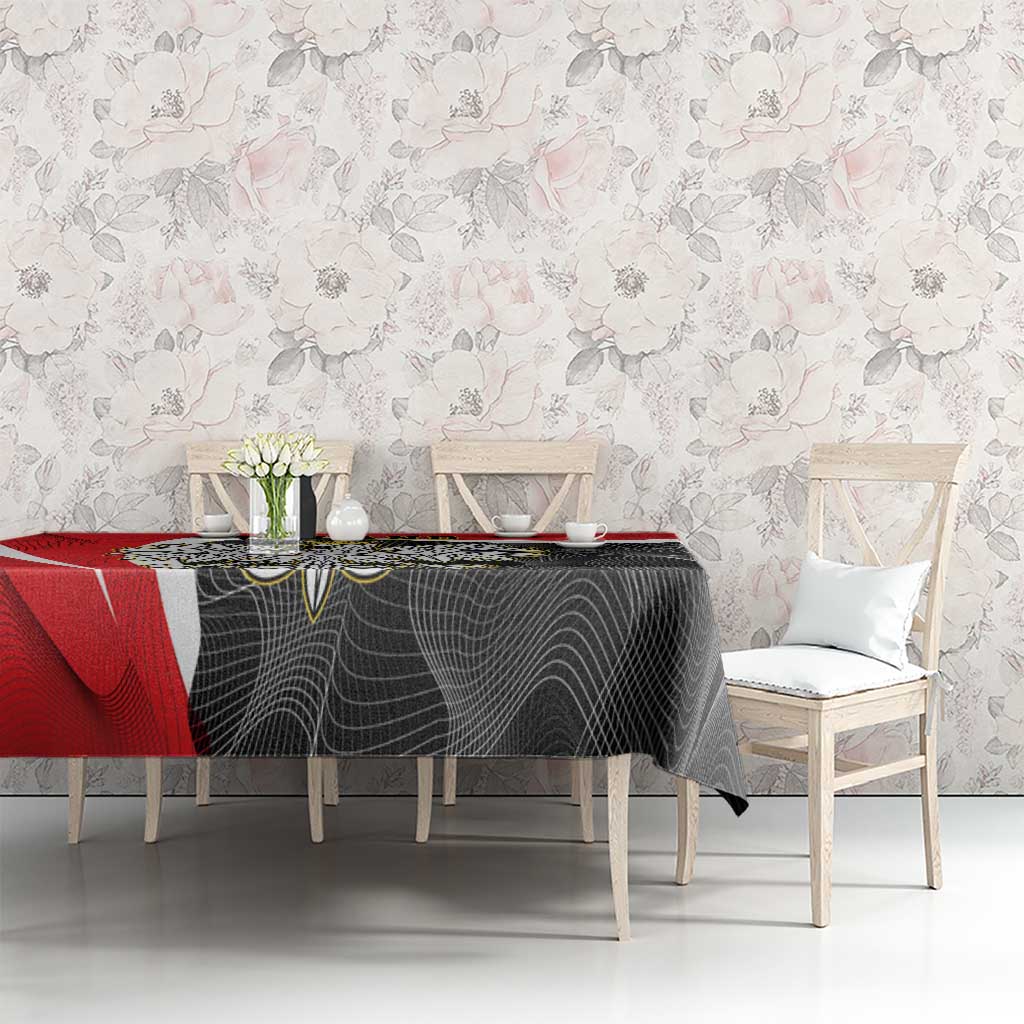 Red and black tablecloth with wave border on rectangular dining table