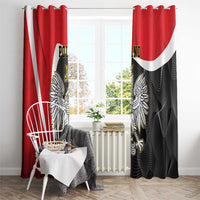 Red window curtains with black patterned fabric, white stripe, and large eagle crest