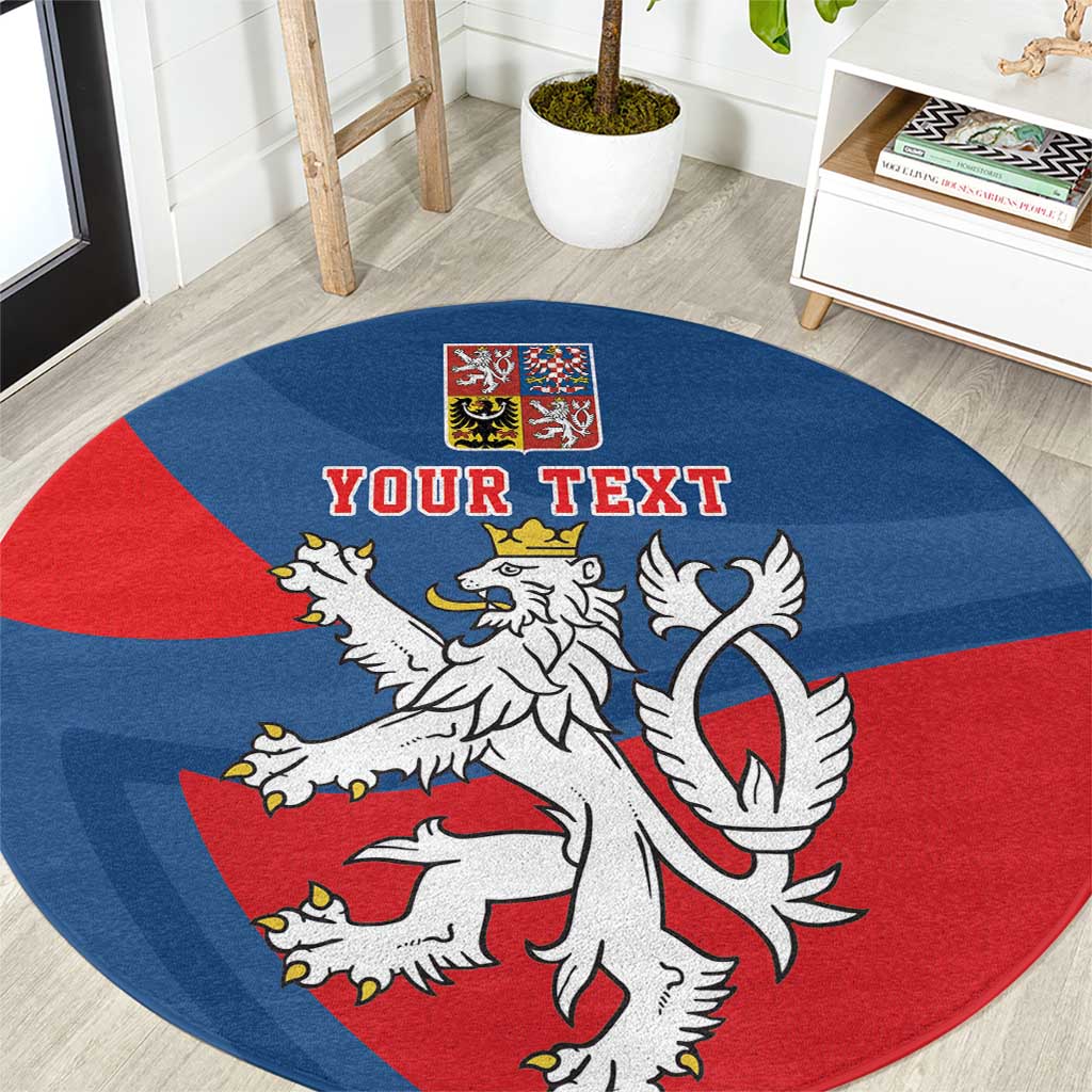 Round rug close-up: blue and red Czech coat of arms with white lion and “YOUR TEXT”