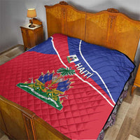 Haiti flag quilt on a bed with blue-red pattern, white stripe, and Haiti coat of arms