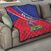 Haiti flag quilt on a couch with red and blue panels, white diagonal stripe, and crest