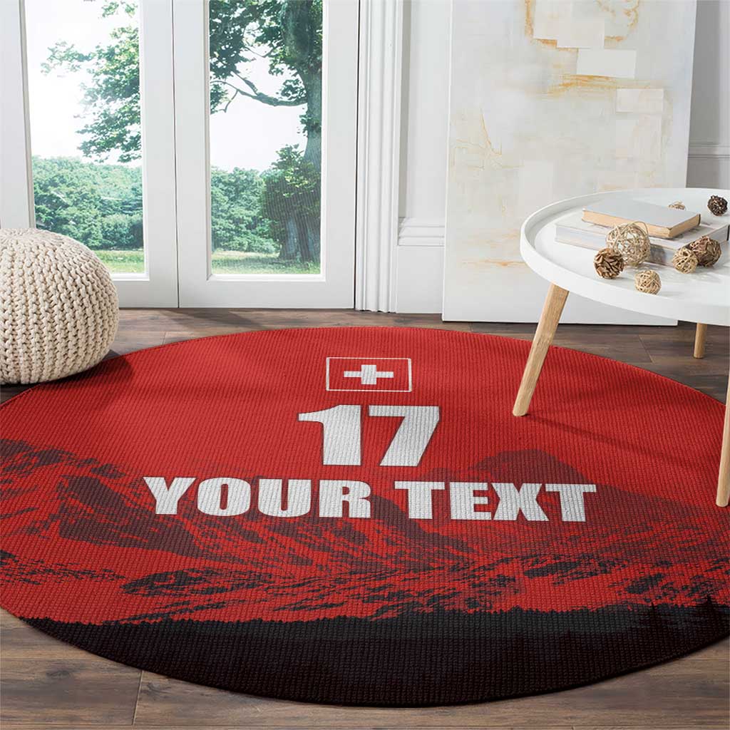 Red round football rug with Swiss cross, 17, and YOUR TEXT print, dark border.