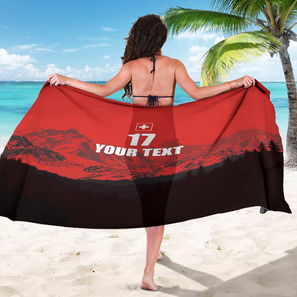 Red and black sarong draped across back, showing Swiss cross, 17, and 'YOUR TEXT'