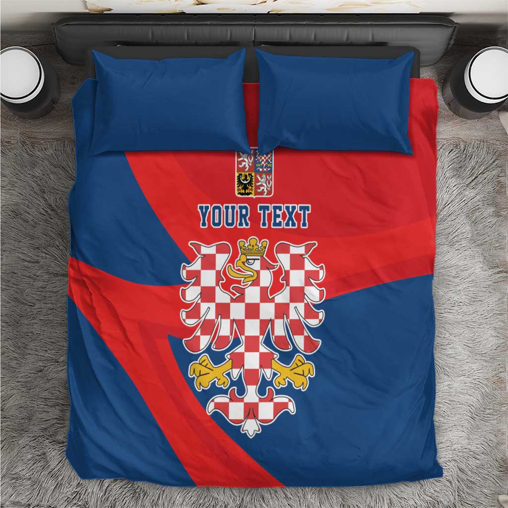 Bedding set with blue and red duvet featuring eagle crest and custom text, plus two blue pillows