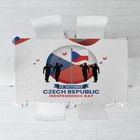 White tablecloth with blue-and-red Czech Independence Day graphic, soldiers and flag.