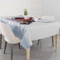 Light blue and white tablecloth corner showing Czech skyline print and Independence Day text.