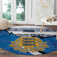 Blue round carpet with large Estonia coat of arms and navy pattern along the edge