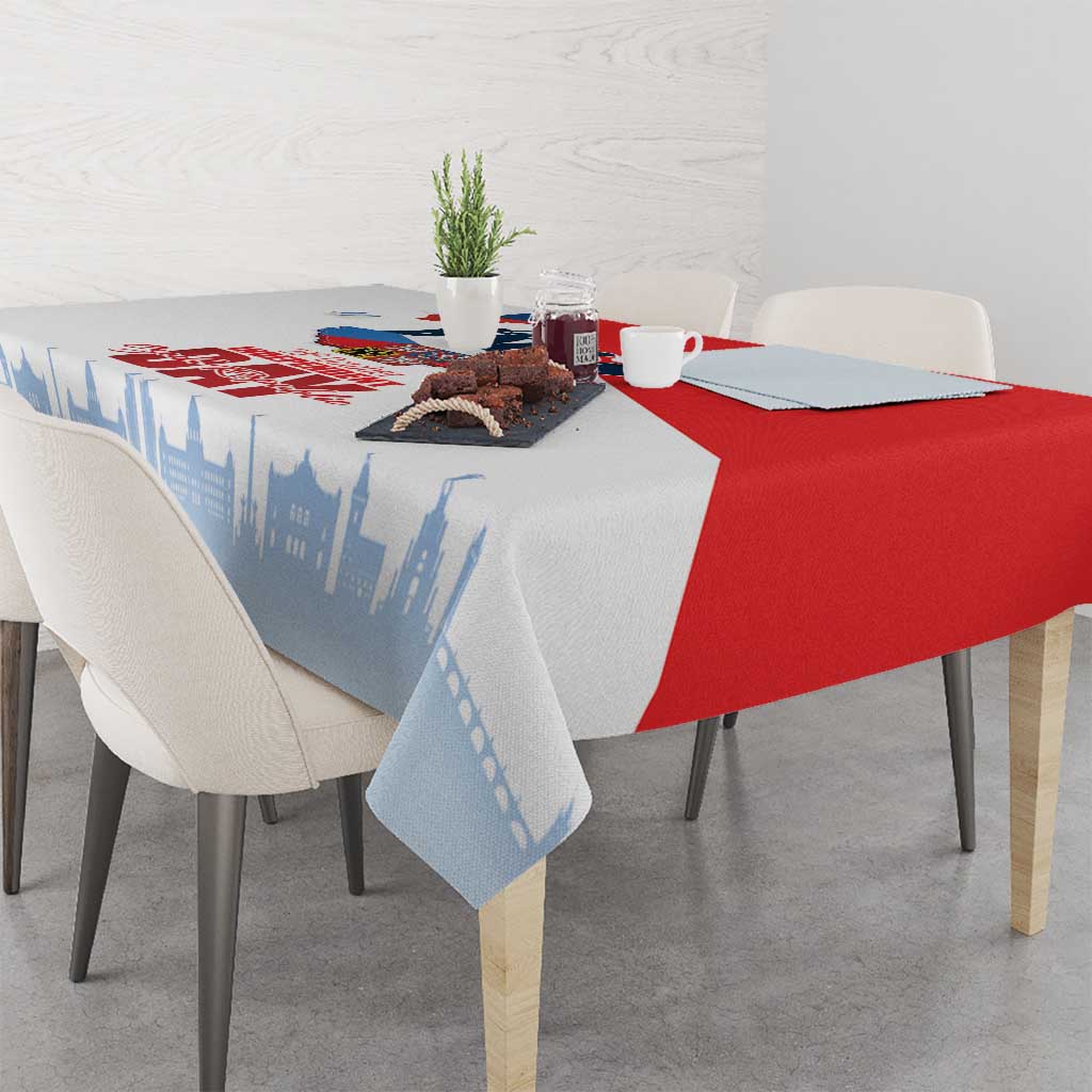 Red and blue printed tablecloth with city skyline and Czech-themed text
