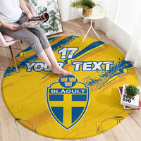 Round sport carpet laid on floor, yellow and blue 17 crest and Your Text graphic