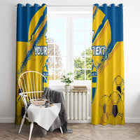 Yellow and blue soccer curtain set with custom text and shield crest, hanging on rod