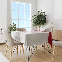 White sports tablecloth with red edge, Poland-style crest, draped on dining table
