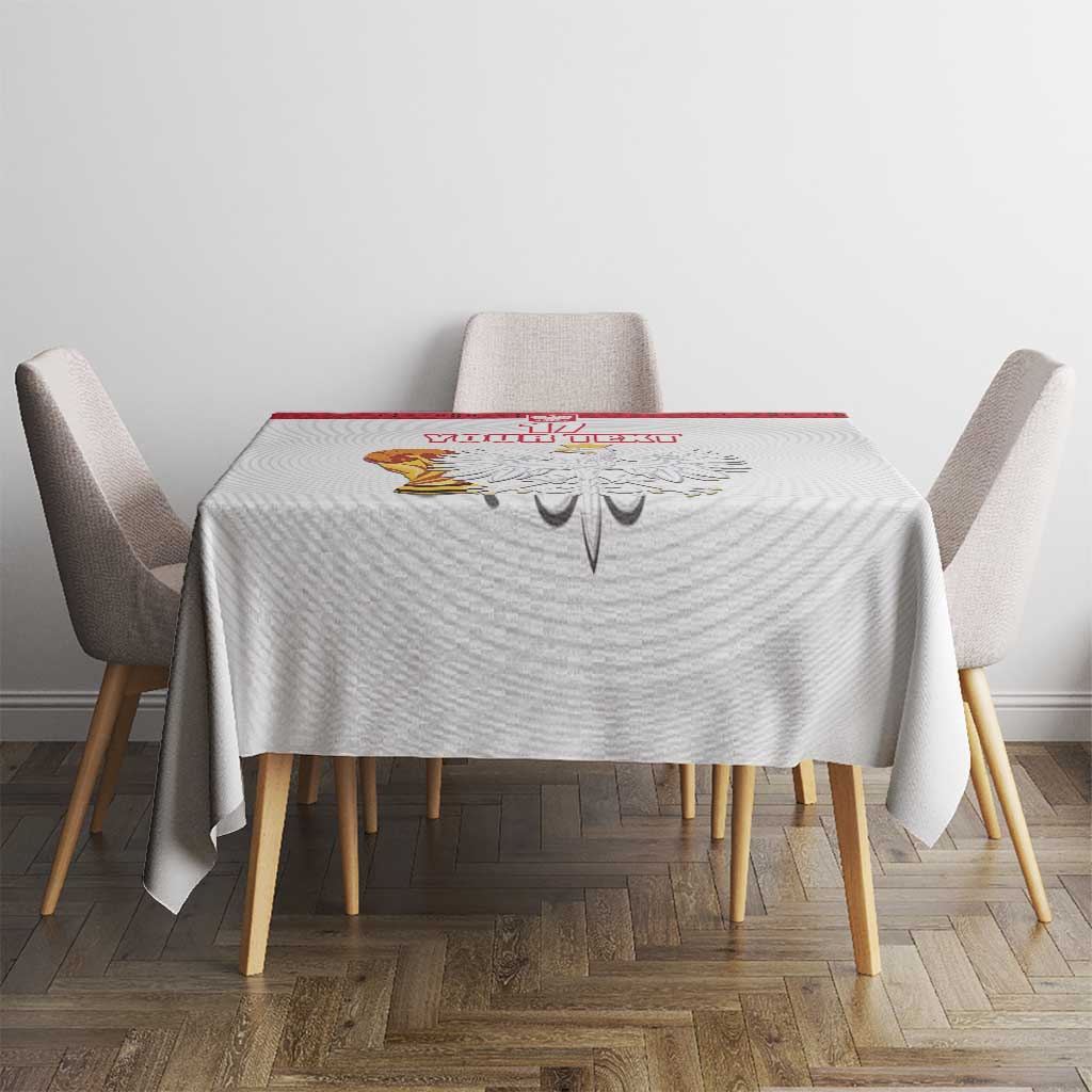 White custom tablecloth with red trim and Poland emblem, on a small dining set