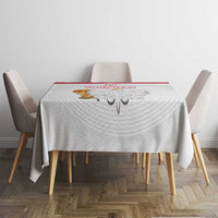 White custom tablecloth with red trim and Poland emblem, on a small dining set