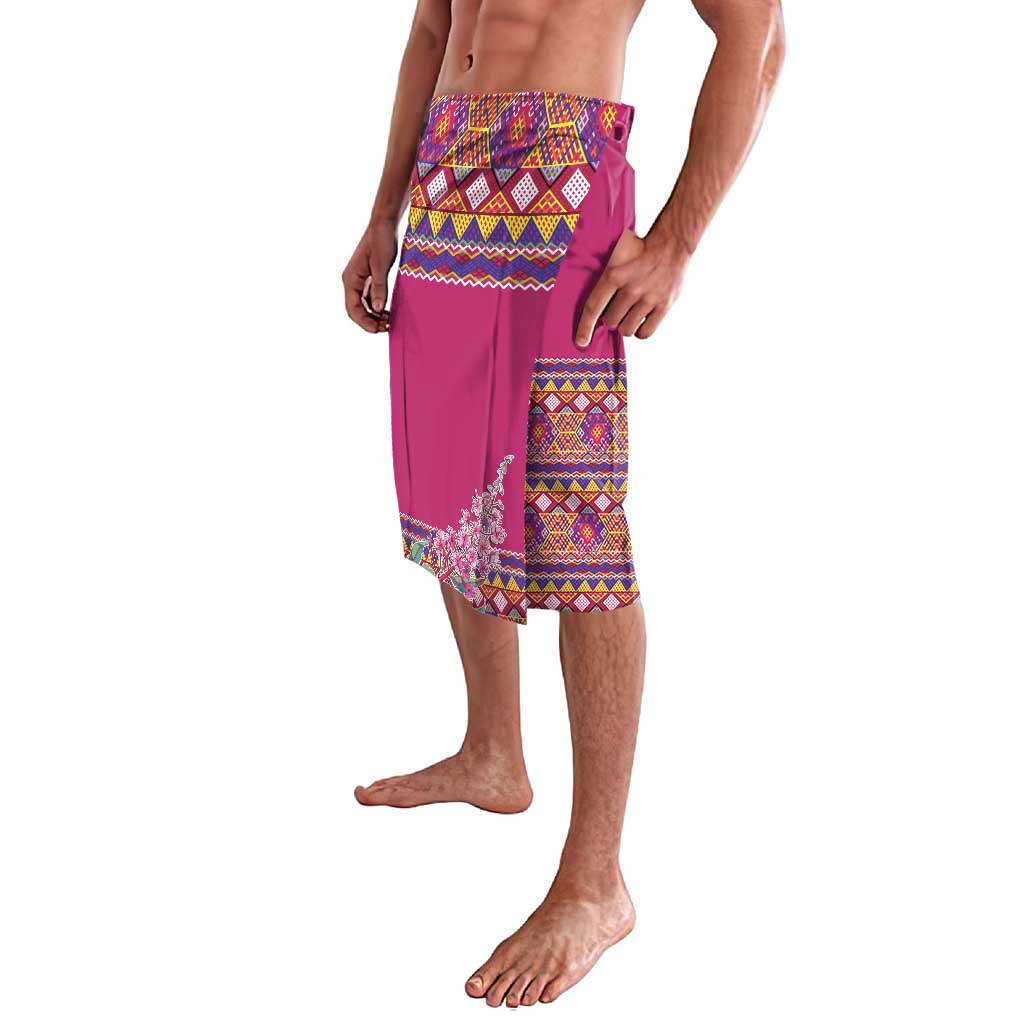 Pink wrap-style lavalava with geometric bands and embroidered side motif.
