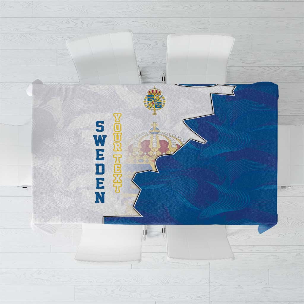 Blue tablecloth with kingdom coat of arms and decorative crest design, square layout